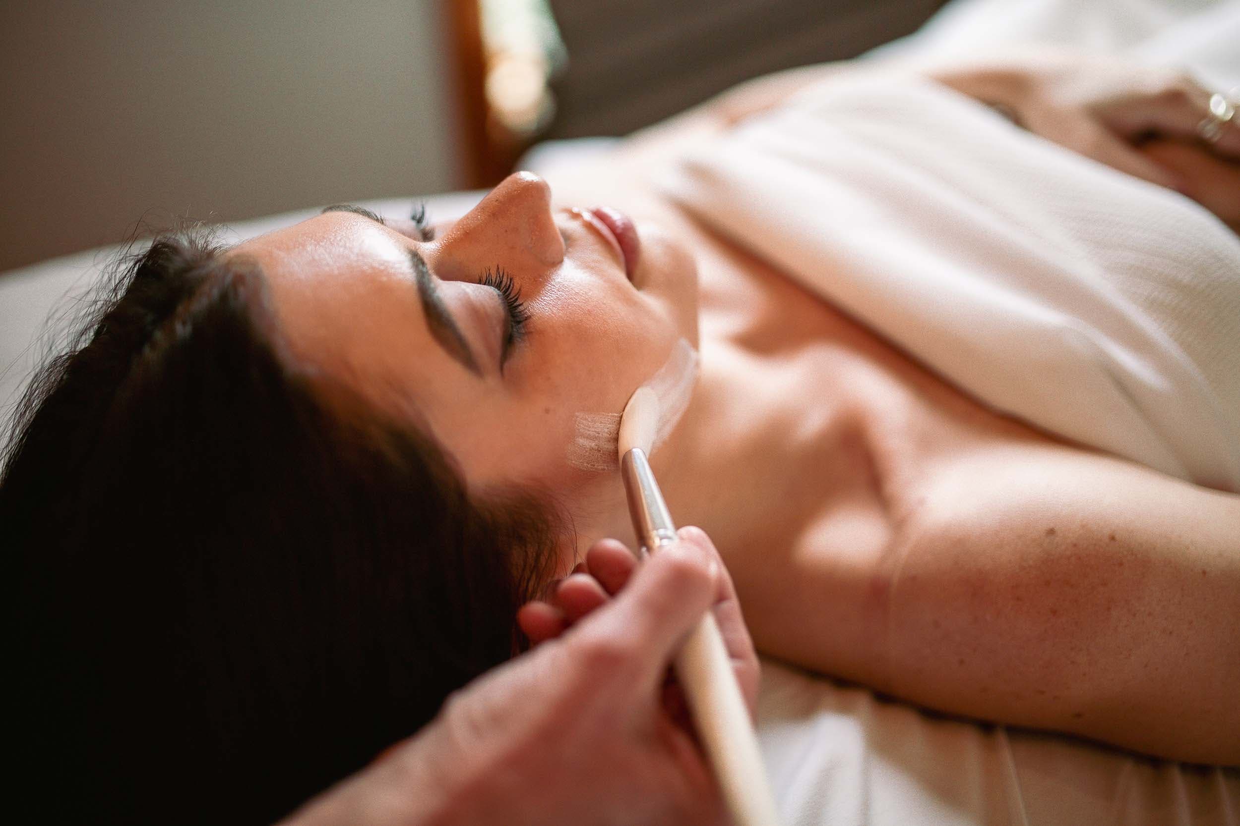 A woman getting a facial at eh TidePools Spa at Headlands