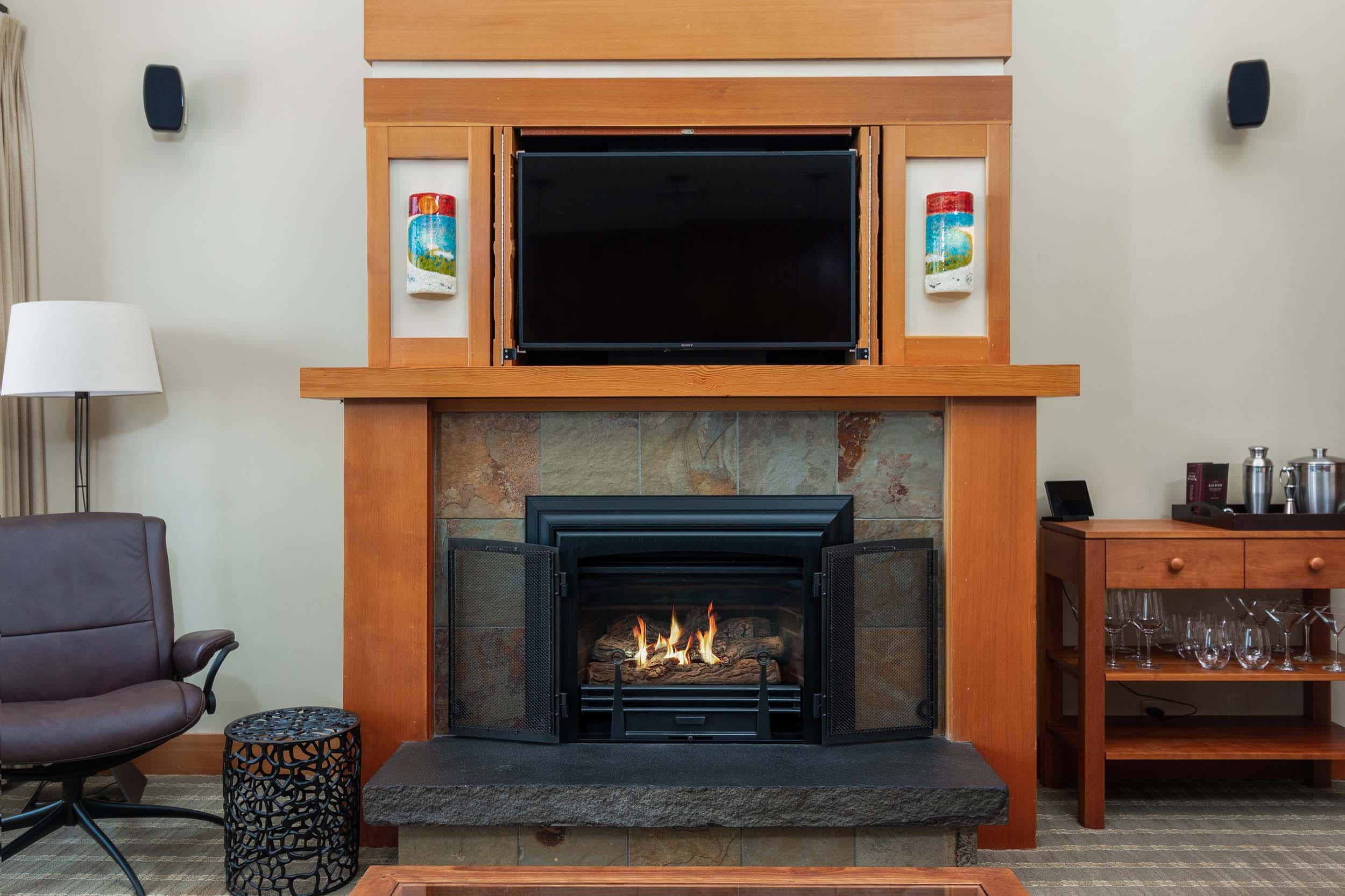 A fireplace area in a 2 bedroom cottage at Headlands