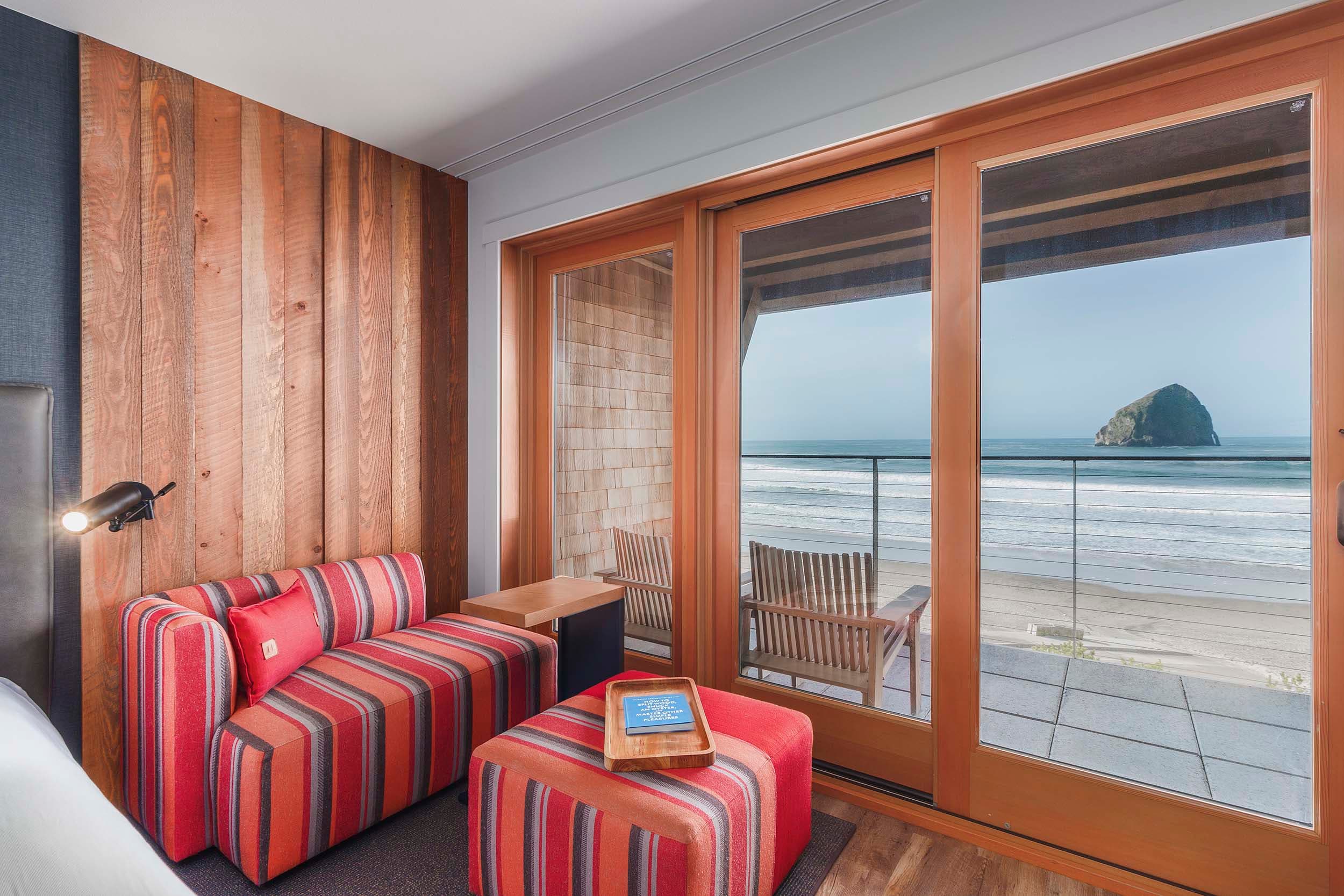 Interior of a two Queens signature room looking at the ocean at Headlands Lodge