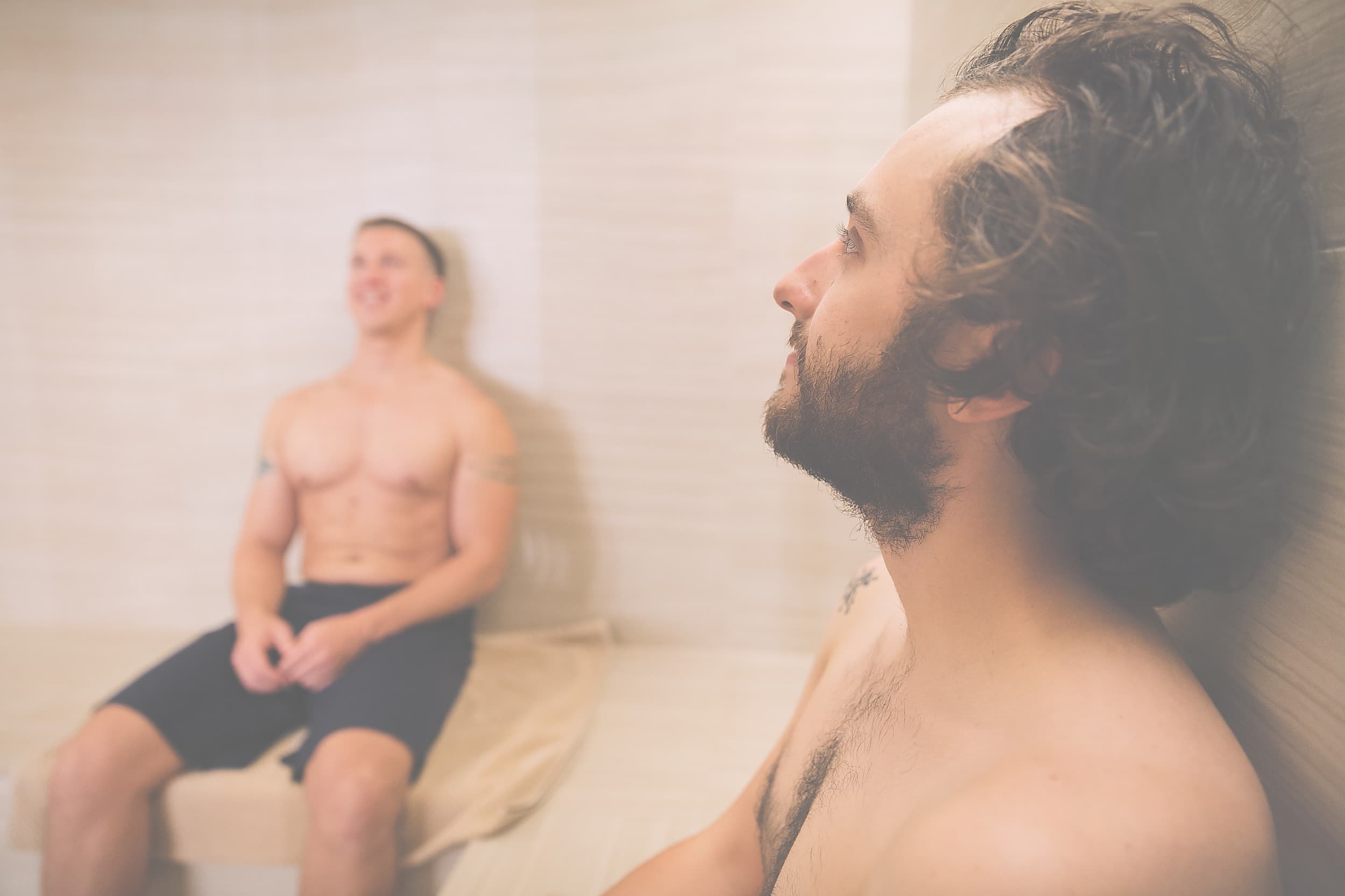 Men unwinding in the eucalyptus steam room at Headlands Coastal Lodge & Spa, a luxury wellness retreat on the Oregon Coast