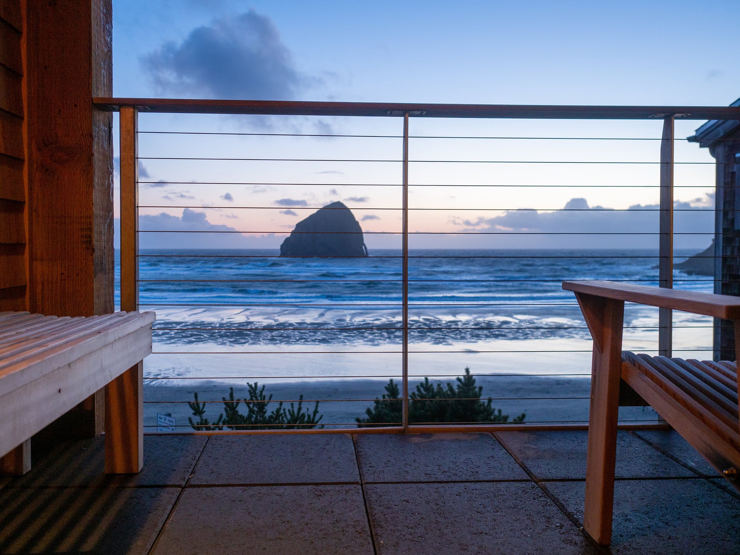 Sunset view of Chief Kiwanda Rock from a private oceanfront deck at Headlands Coastal Lodge & Spa on the Oregon Coast