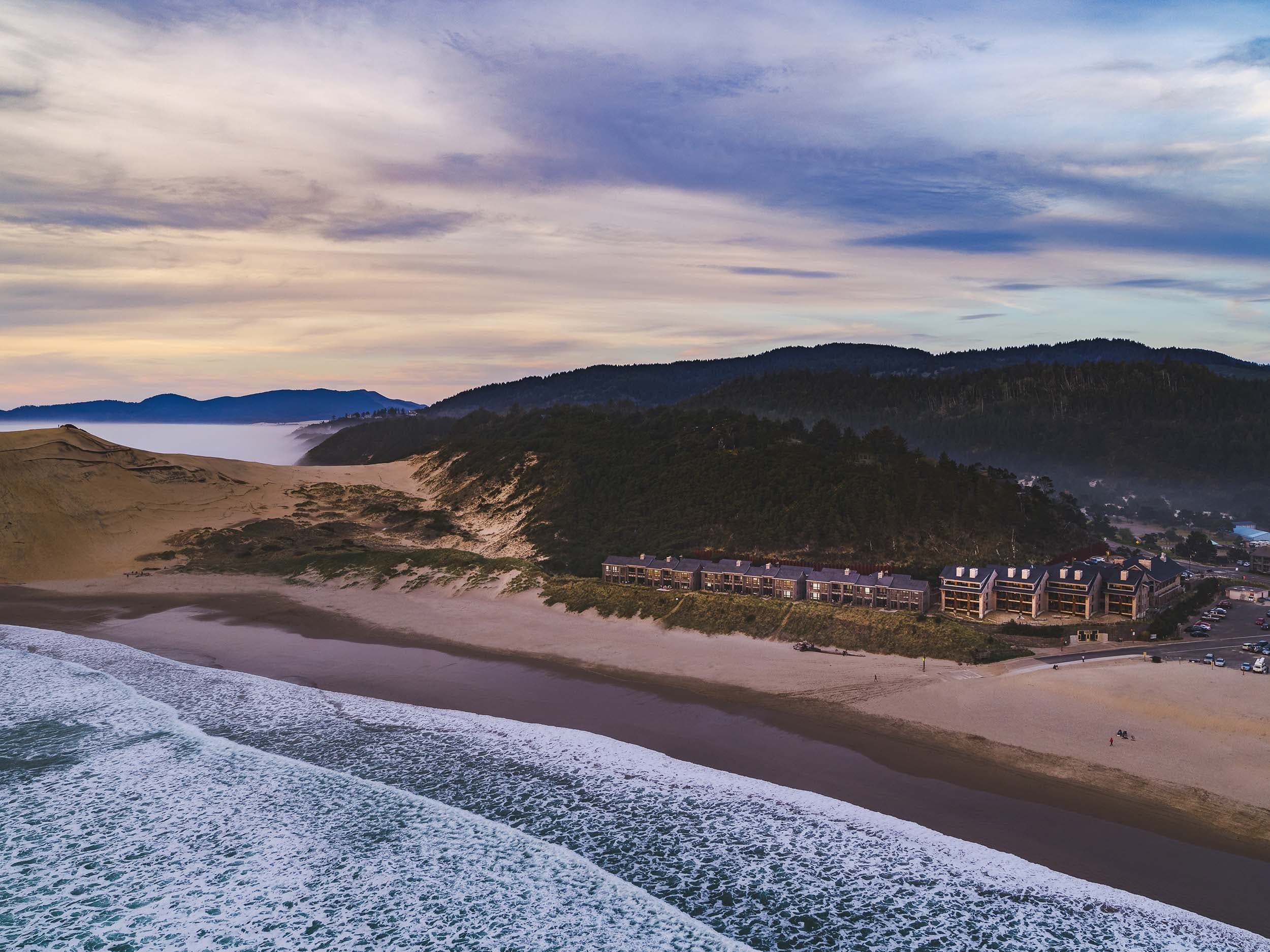 An aerial view of Headlands and the beach in the early morning
