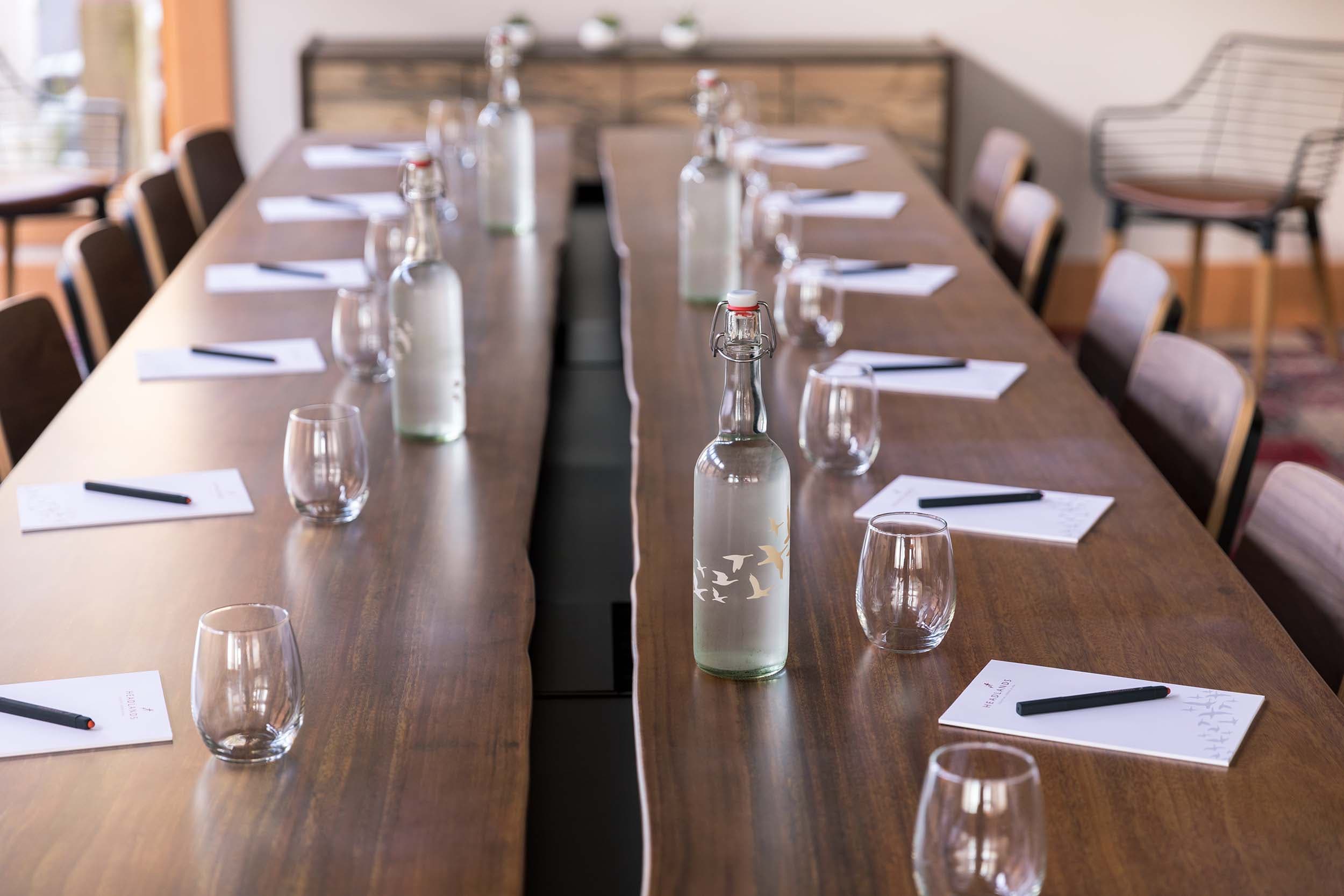 A close up of a table ready for a meeting in the Longitude venue at Headlands