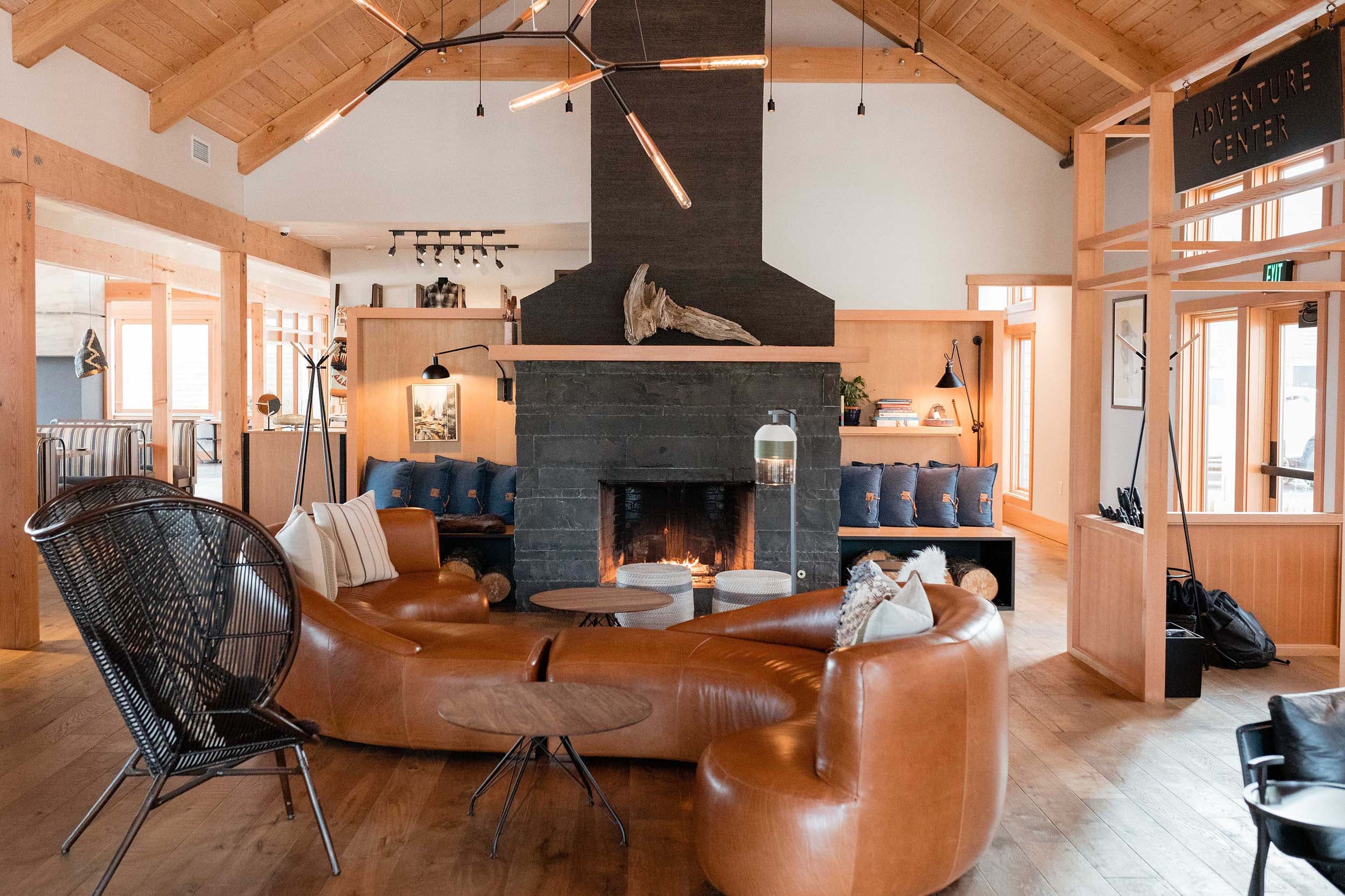 The lounge area off the lobby at Headlands with a large fireplace and cozy seating