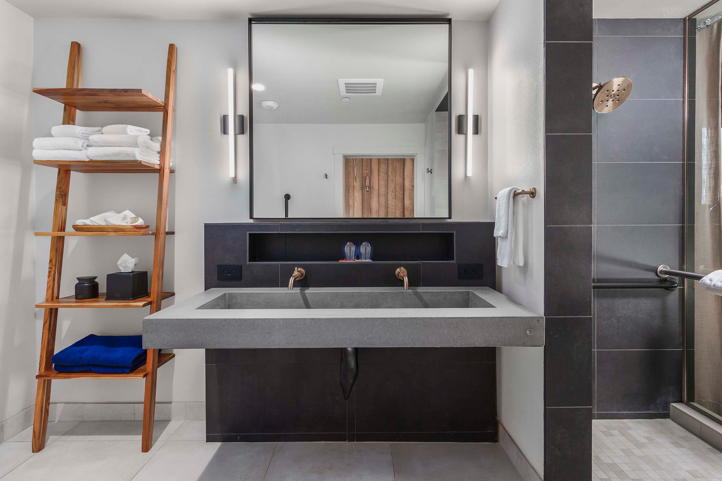 A modern bathroom with bright lighting in a King Sunlight Accessible at Headlands