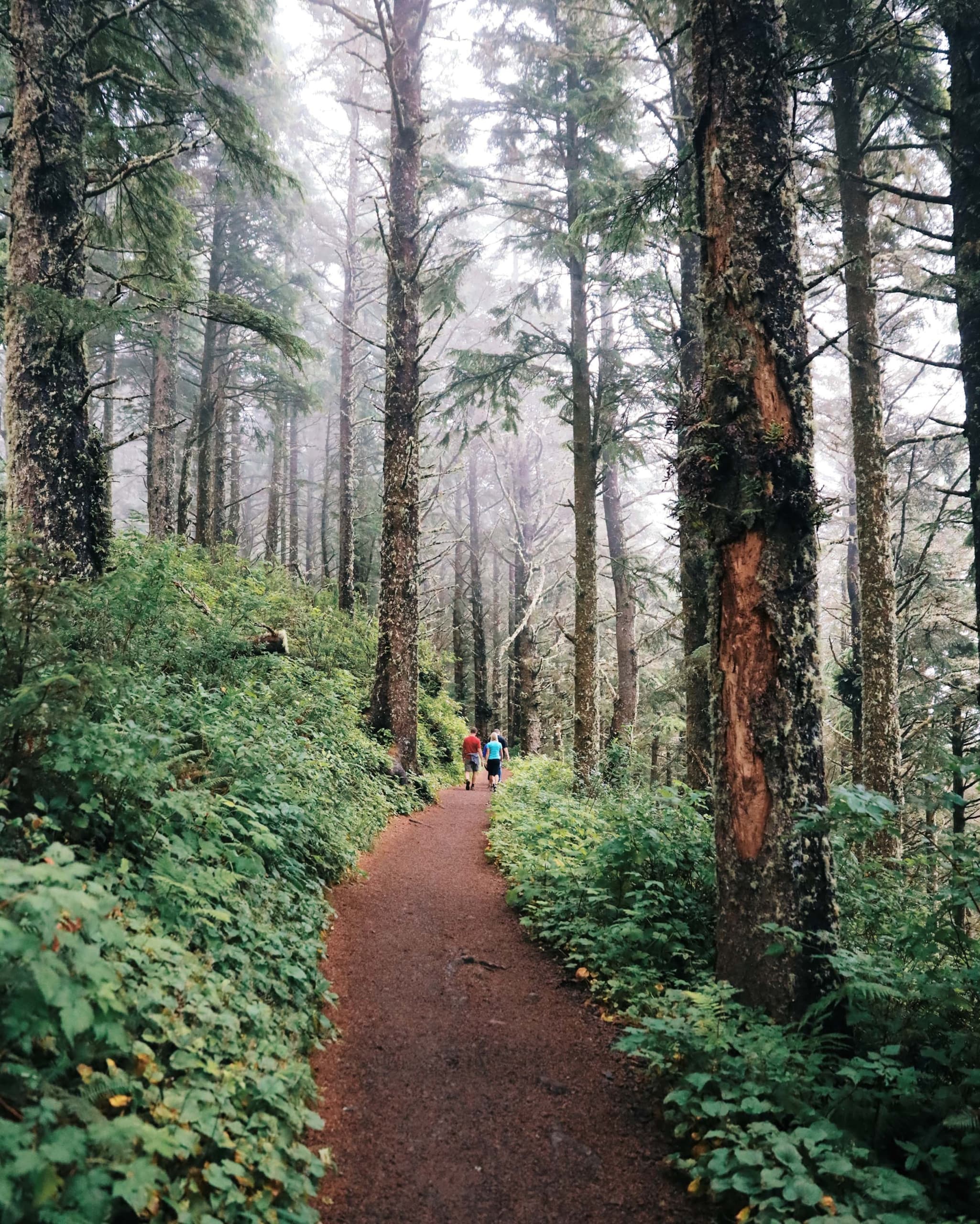 2 people walking Pacific City Pathway