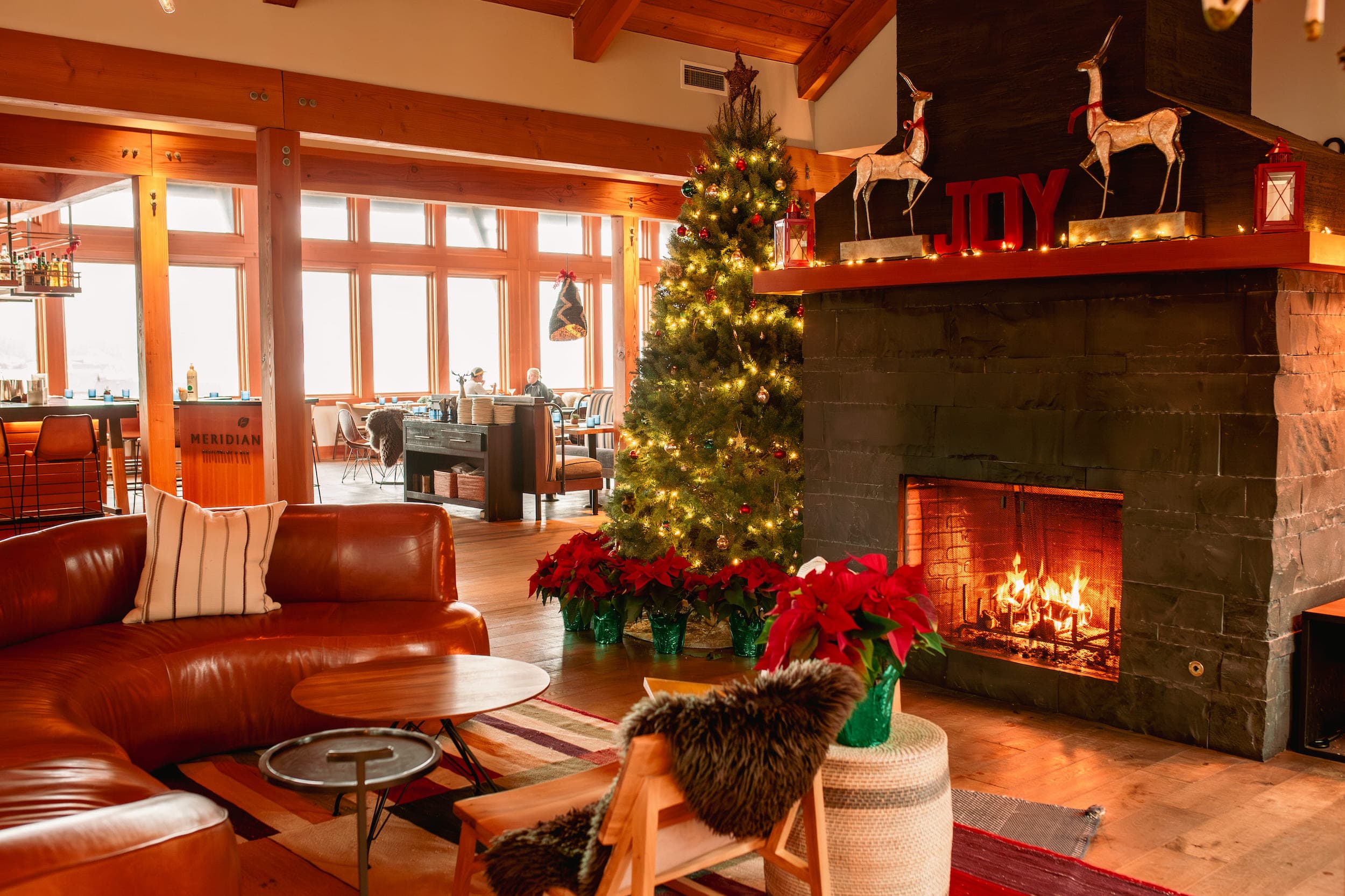 The Headlands lobby decorated for Christmas with the fireplace active